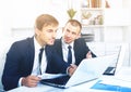 Two young men coworkers working in firm office Royalty Free Stock Photo