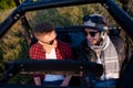Two young men driving a off road buggy car Royalty Free Stock Photo