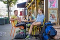 Two young men enjoying glass of beer in cafe in Paris