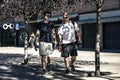 Two young men are going along the path at camera. Royalty Free Stock Photo