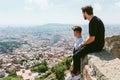 Two young men looking at the views form the top of a mountain. Royalty Free Stock Photo