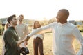 Two Young Men from a Multi-Ethnic Group Shaking Hands after a Virtual Reality Game Royalty Free Stock Photo