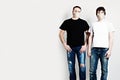 Two young men in protective mask on white banner background Royalty Free Stock Photo