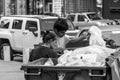 Two young men searching in a trash bin near the Bucharest University