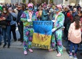 Two young men in decorated suits hold up a poster of Ukraine at New York's annual Easter parade.