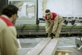 Two young men working in the furniture factory Royalty Free Stock Photo