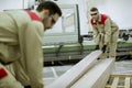 Two young men working in the furniture factory Royalty Free Stock Photo