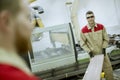 Two young men working in the furniture factory Royalty Free Stock Photo