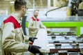 Two young men working in the furniture factory Royalty Free Stock Photo