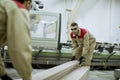 Two young men working in the furniture factory Royalty Free Stock Photo