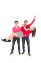 Two young men and a young girl dressed in red Royalty Free Stock Photo