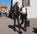 MILAN - SEPTEMBER 21: Two young models walking after LES COPAINS fashion show, during Milan Fashion Week spring/summer 2018 Royalty Free Stock Photo
