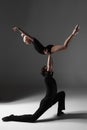 Two young modern ballet dancers on gray studio Royalty Free Stock Photo