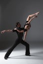 Two young modern ballet dancers on gray studio Royalty Free Stock Photo