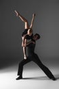 Two young modern ballet dancers on gray studio Royalty Free Stock Photo