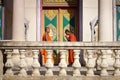 Two young monks meet and salute in buddhist pagoda Royalty Free Stock Photo