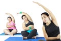 Two young overweight women doing yoga