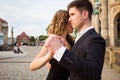 Two young people dancing tango outside on city square Royalty Free Stock Photo