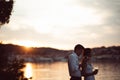 Two young people enjoying a glass of red wine in the sunset on the seaside.Healthy glass od homemade red wine,Mediterranean Royalty Free Stock Photo