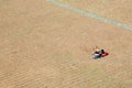 Two young people resting in Piazza del Campo