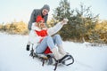 Two young people sliding on a sled Royalty Free Stock Photo