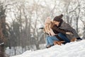 Two young people sliding on a sled Royalty Free Stock Photo