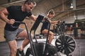 Two young people training toughly in simulators Royalty Free Stock Photo