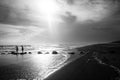 Two young people walk along a jetty out to sea Royalty Free Stock Photo