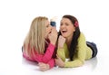 Two young pretty girls gossiping Royalty Free Stock Photo