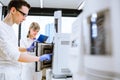 Two young researchers carrying out experiments in a lab Royalty Free Stock Photo