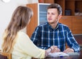 Two collegues working with documents together in office Royalty Free Stock Photo