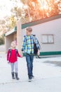 Two young school kids walking Royalty Free Stock Photo