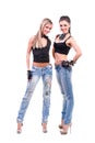 Two young women in denim jeans isolated on Royalty Free Stock Photo