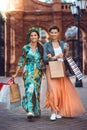 Two young fashion women with shopping bags in the city Royalty Free Stock Photo