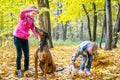 Two young sisters with pets in park Royalty Free Stock Photo