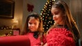 Little sisters putting letters into Santa mailbox Royalty Free Stock Photo