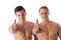 Two young smiling bodybuilder gesturing thumbs up