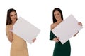 Two young smiling women holding two pieces of blank paper Royalty Free Stock Photo