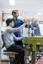 Two young students working on a project together in lab Royalty Free Stock Photo