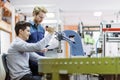 Two young students working on a project together in lab Royalty Free Stock Photo