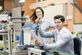 Two young students working on a project together in lab Royalty Free Stock Photo