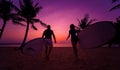 Two young surfers going into the sea with surf boards Royalty Free Stock Photo