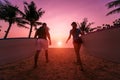 Two young surfers going into the sea with surf boards Royalty Free Stock Photo