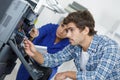 Two young technicians repairing printer Royalty Free Stock Photo