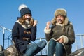 Two young teenage girls having fun outdoors, girlfriends in winter clothes, positive people and friendship concept. Royalty Free Stock Photo