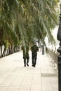 Two young Thai soldiers patrolling around the palace area in full uniform before the kings funeral in Thailand, Southeast Asia