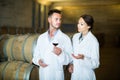 Two young wine expert working with wine sample