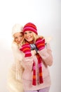 Two young winter girls friends in gloves