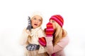 Two young winter girls friends in gloves