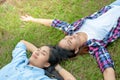 Two Young Woman ,Beautiful girl is relaxing lying on the grass i Royalty Free Stock Photo